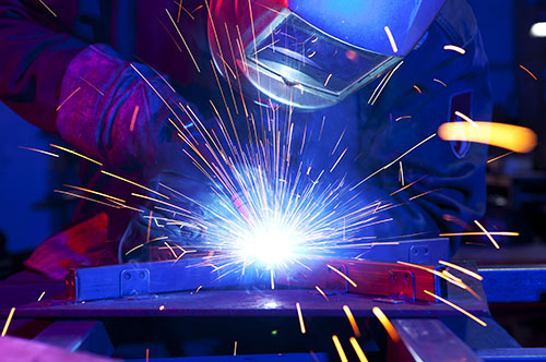 Photo of person welding